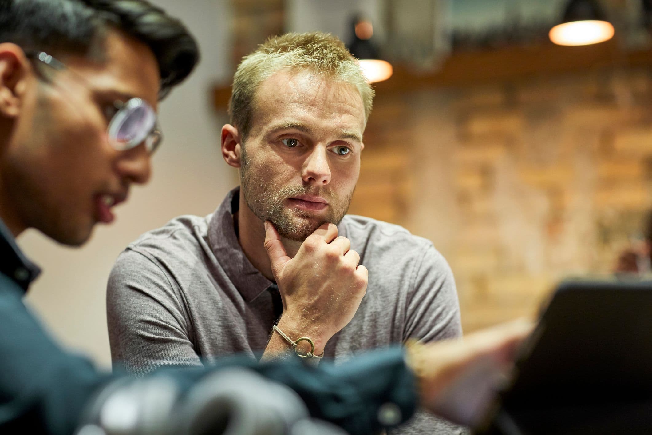 Man producing an online event at his laptop