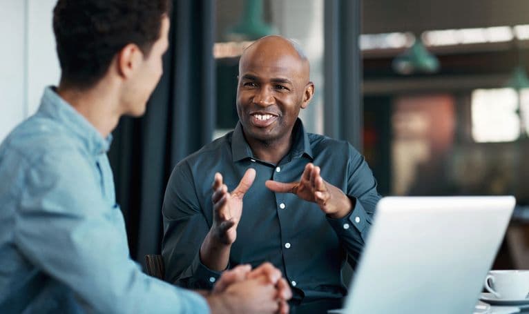 Two people in a communication training conversation